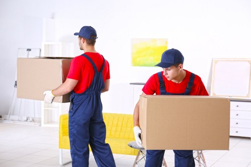 Home moving service in Noak Hill with boxes and furniture ready for loading