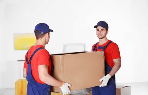Furniture collection team handling a sofa pick-up in Noak Hill