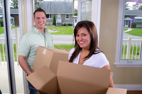 Packing materials and labeled boxes prepared for a local move in Noak Hill