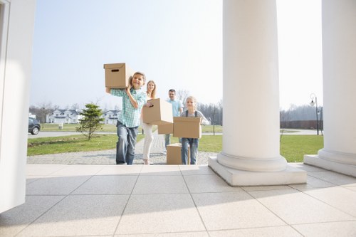 Packed household items prepared for a residential removal service in Noak Hill
