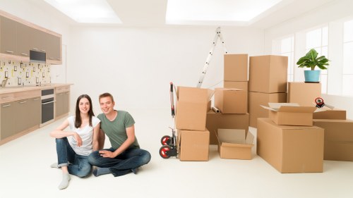 Removal team handling furniture and boxes for a local home move