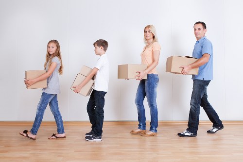 Packed household furniture ready for loading into a removals van